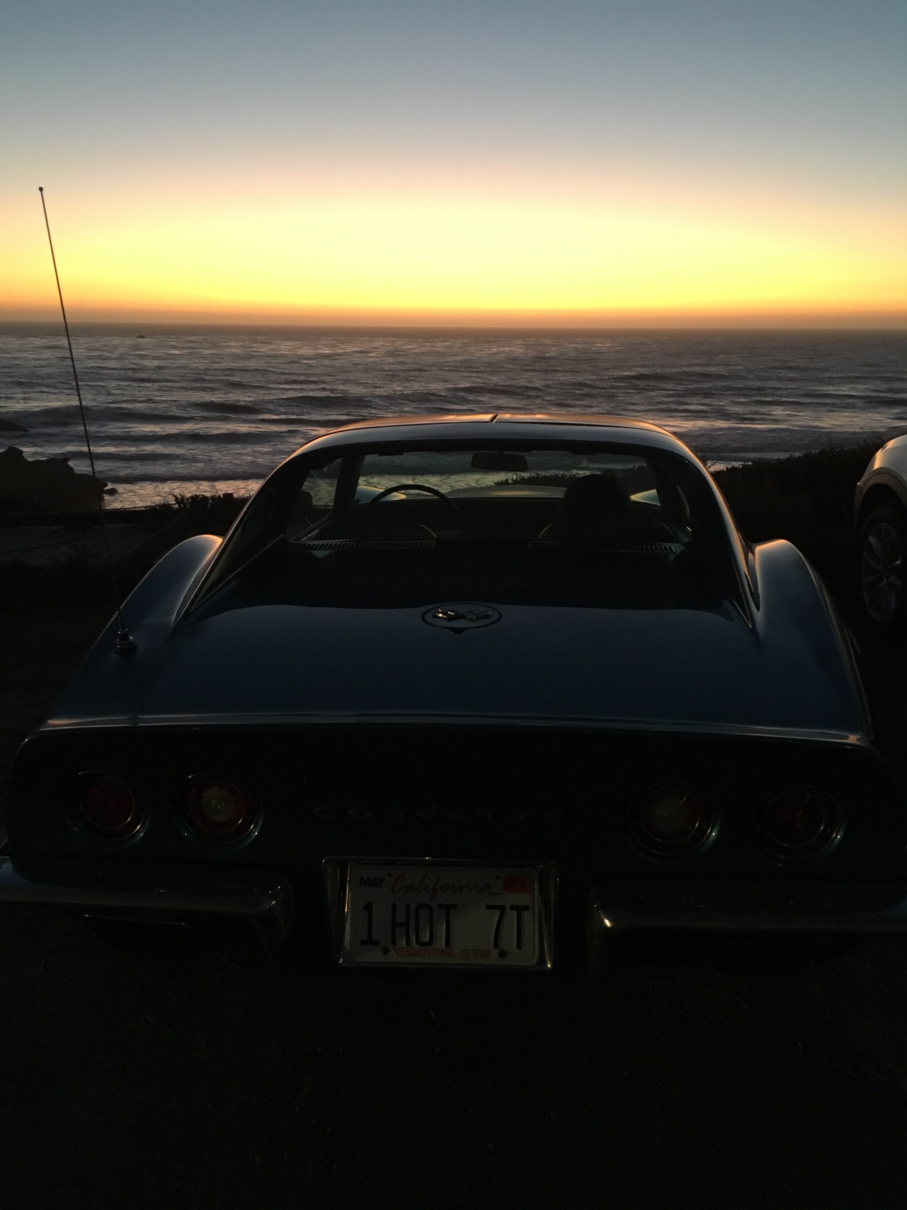 Ron Bartow's 1970 Corvette coupe at dusk at the beach in Cambria, CA.